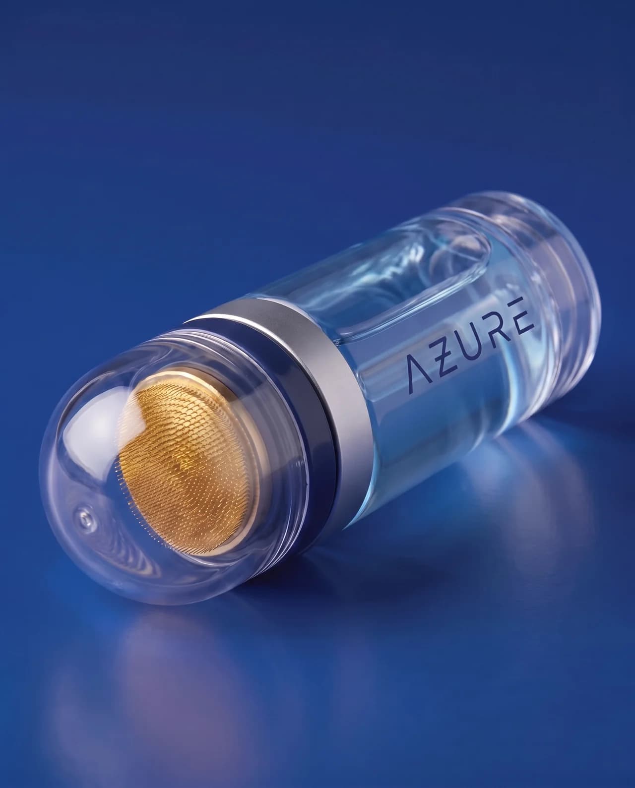 Macro of the AZURE applicator's gold-plated 0.5 mm micro-needle pad under its clear dome